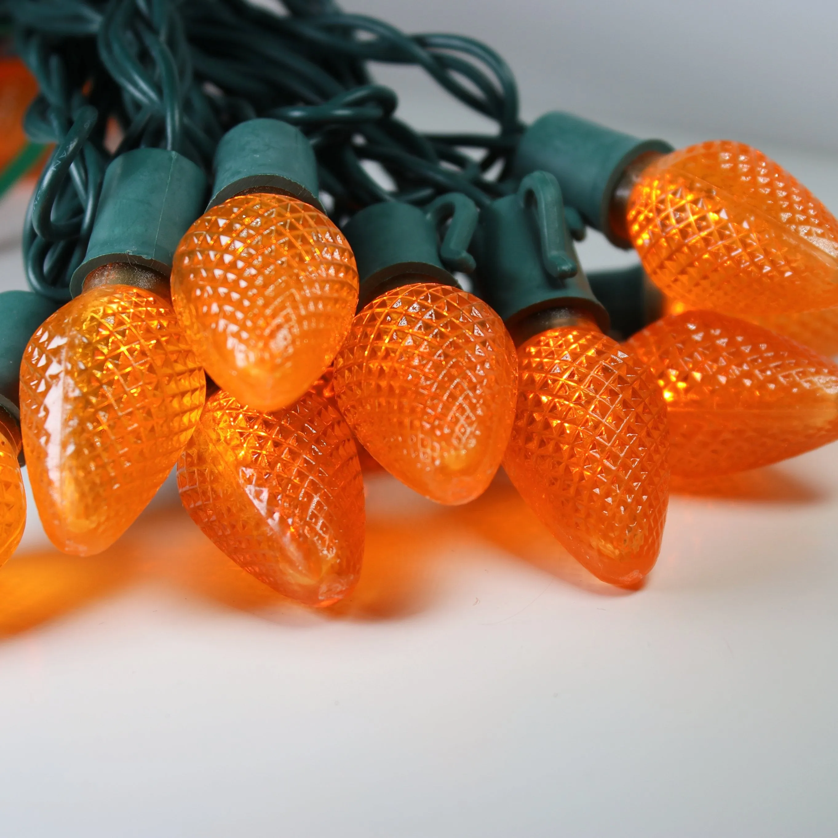 25-light C7 Orange LED Christmas Lights, 8" Spacing Green Wire